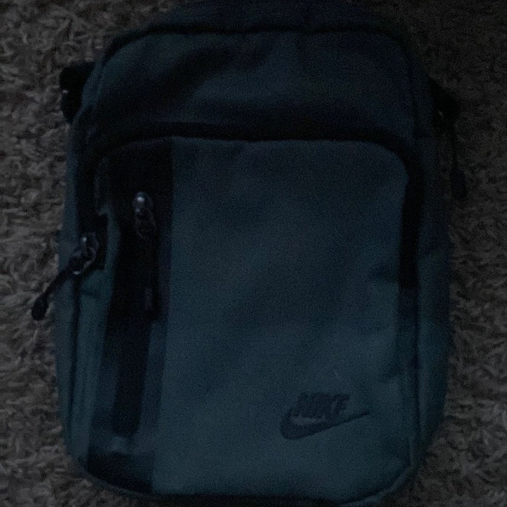 Grey Nike tech crossbody bag
